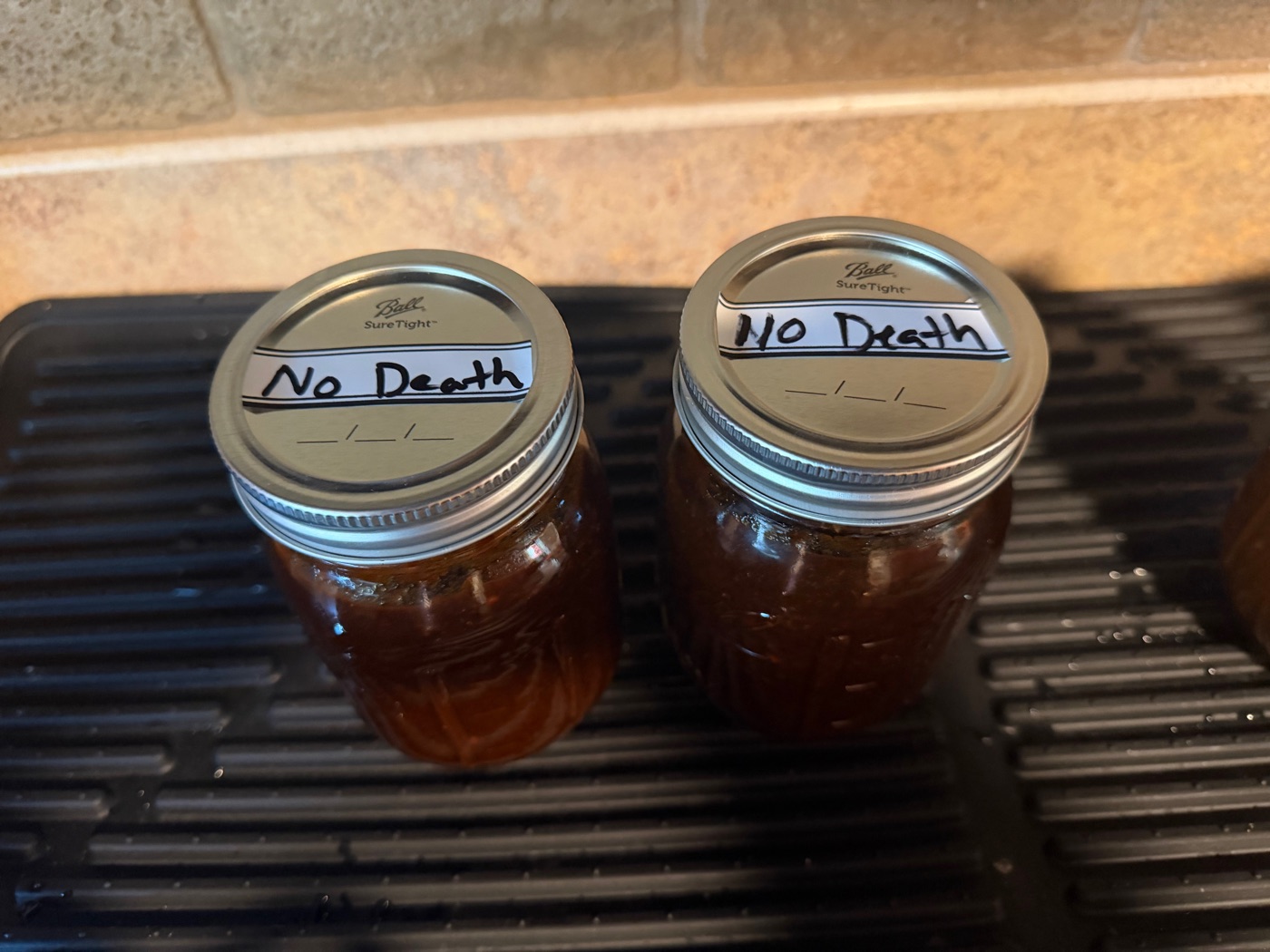 No Death hot sauce, dark red in Ball jars